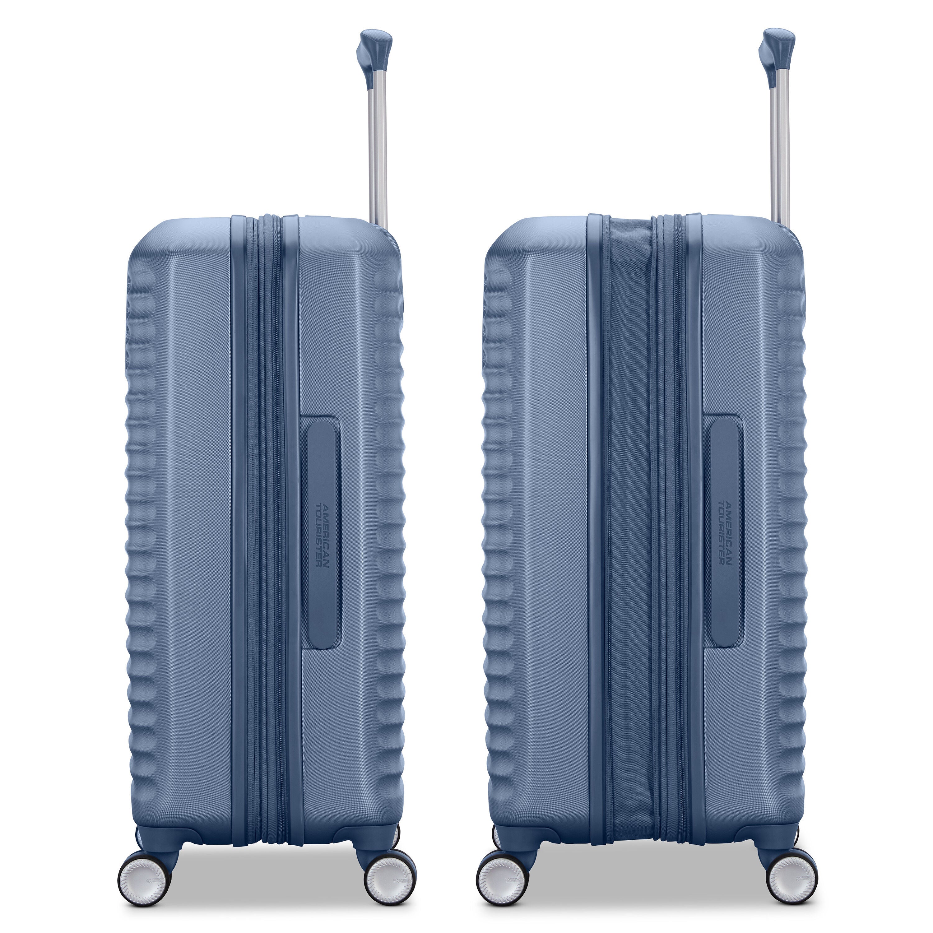 Two blue suitcases standing side by side with extended handles