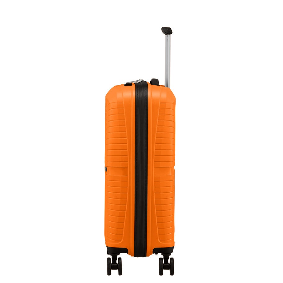 Side view of orange carry-on with extended handle